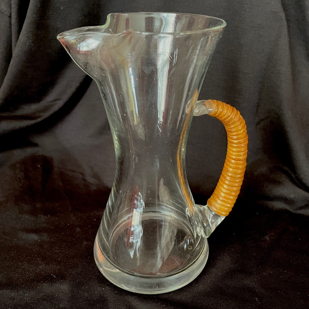 Vintage CARL AUBOCK glass pitcher with rattan wrapped handle.